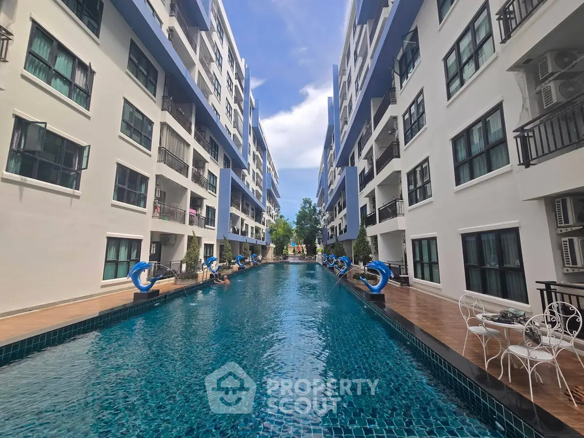 Luxurious apartment complex with stunning pool and modern architecture
