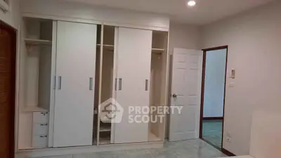 Spacious bedroom with built-in wardrobes and modern design