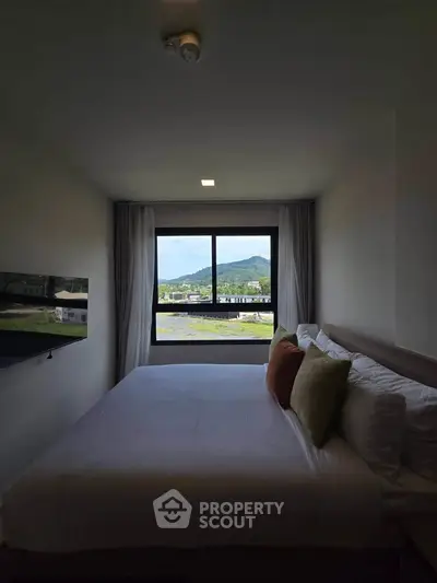 Cozy bedroom with mountain view and modern decor