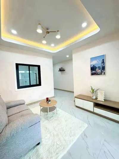 Modern living room with stylish ceiling lights and cozy decor