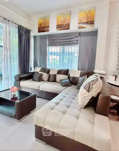 Stylish modern living room with large sectional sofa and elegant decor