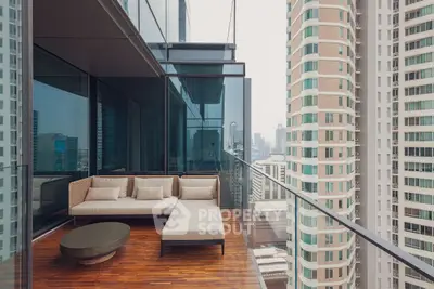 Luxurious high-rise balcony with stunning city view and modern outdoor seating.