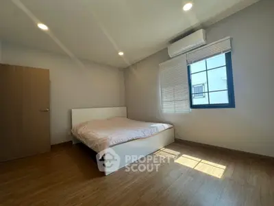 Spacious bedroom with modern design and natural light