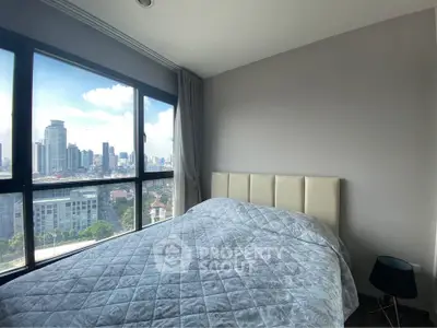 Modern bedroom with stunning city view and large windows