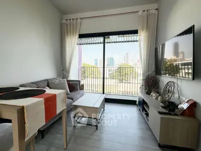 Modern living room with city view, stylish furniture, and natural light