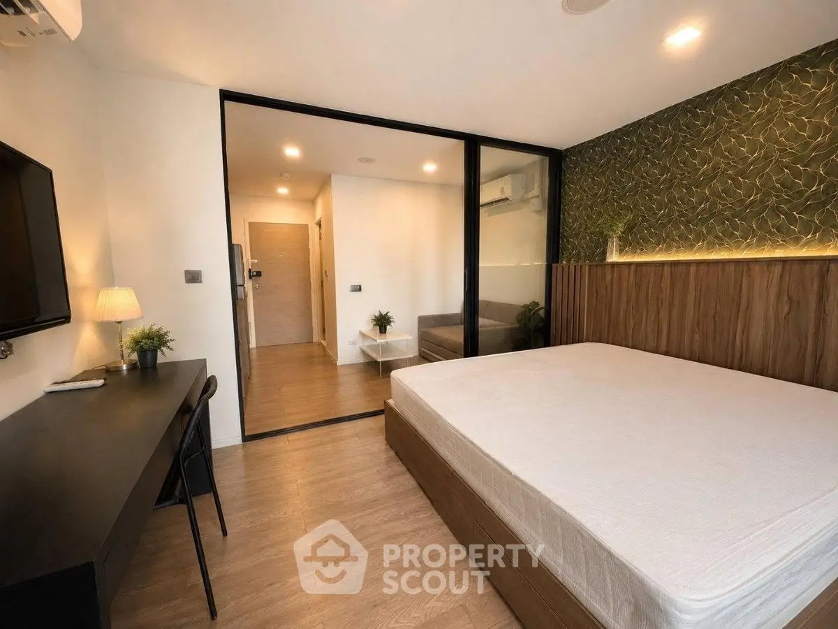 Modern bedroom with stylish decor and spacious layout in a contemporary apartment.