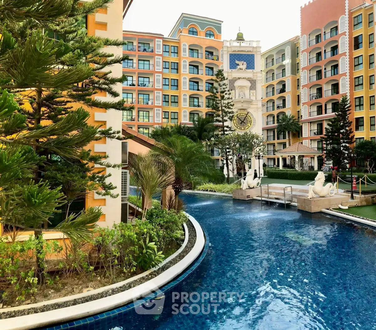 Luxurious resort-style apartment complex with stunning pool and lush greenery.