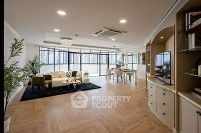 Spacious modern living room with elegant decor and large windows