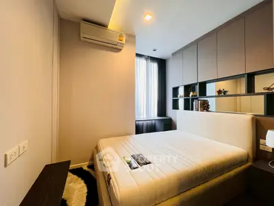 Modern bedroom with stylish decor and ample natural light