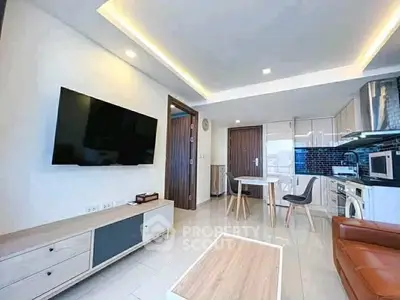 Modern living room with sleek furniture and wall-mounted TV in a stylish apartment.