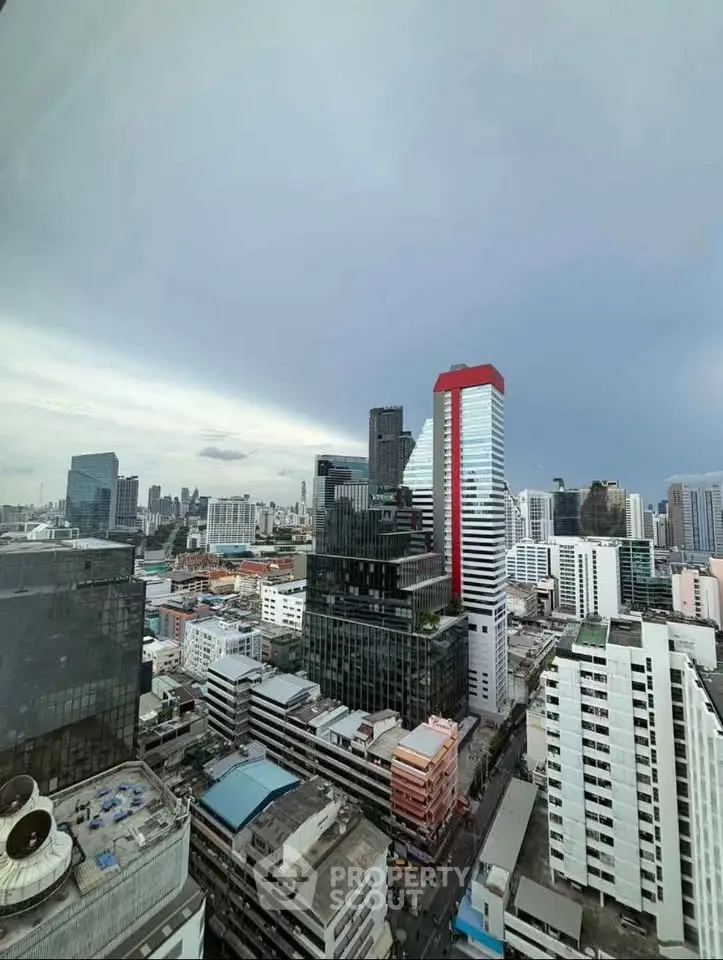Stunning cityscape view from high-rise building showcasing modern urban architecture.