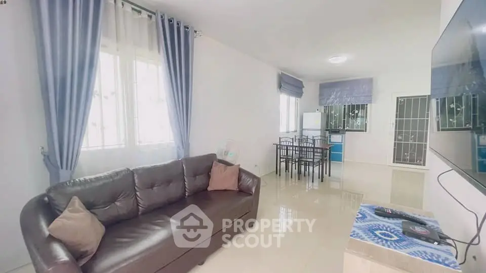 Spacious living room with modern decor and natural light