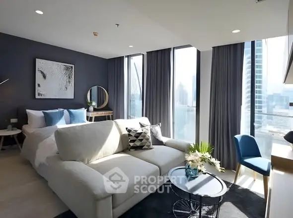 Luxurious modern living room with city view, elegant decor, and abundant natural light.