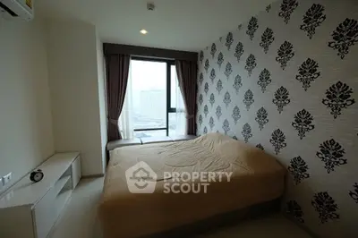 Stylish bedroom with modern wallpaper and city view window