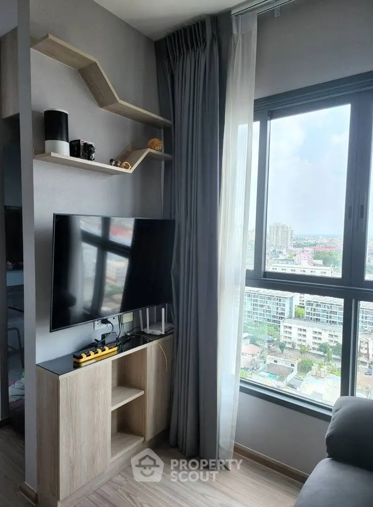 Modern living room with stylish shelving and city view from large window