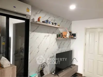 Modern living room with marble accent wall and sleek TV setup