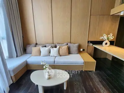 Modern living room with stylish wooden paneling and cozy seating area.