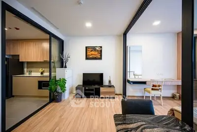 Modern living room with open kitchen and stylish decor