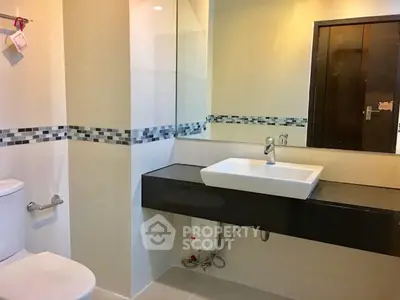 Modern bathroom with sleek design and stylish fixtures in a contemporary home.