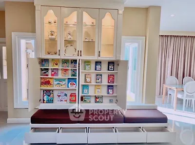 Stylish living room with built-in bookshelf and cozy seating area