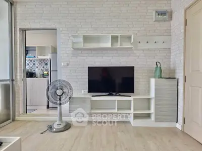 Modern living room with stylish TV unit and open kitchen view