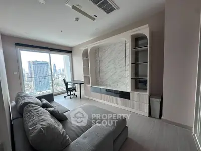 Modern living room with city view, featuring a stylish sofa and built-in shelving unit.