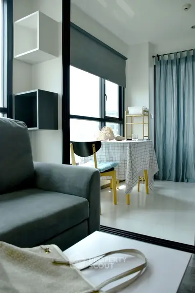 Modern living room with cozy dining area and stylish decor