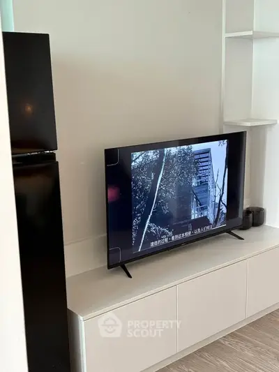 Modern living room with sleek TV setup and minimalist decor