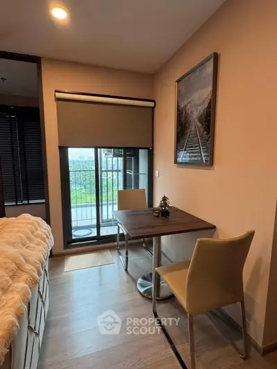 Cozy bedroom with balcony view and modern decor