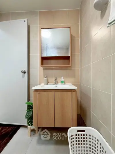 Modern bathroom with sleek vanity and mirror in a stylish apartment