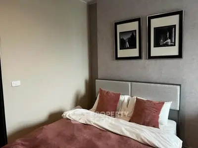 Cozy bedroom with stylish decor and plush bedding