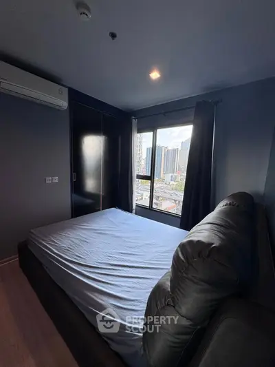 Modern bedroom with city view and sleek design