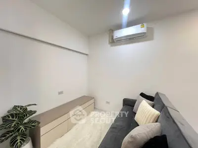 Modern living room with sleek design and cozy sofa
