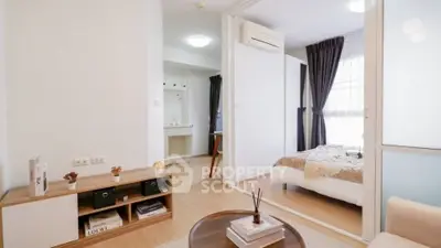 Modern apartment interior with cozy living room and stylish bedroom, featuring elegant decor and natural light.