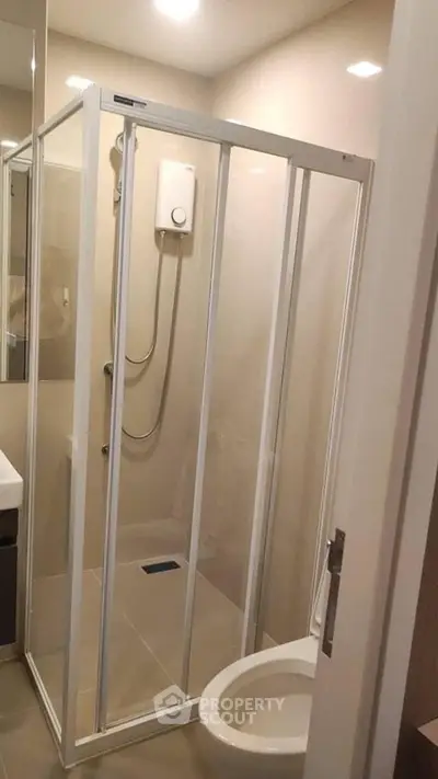 Compact bathroom with shower enclosure and modern fixtures