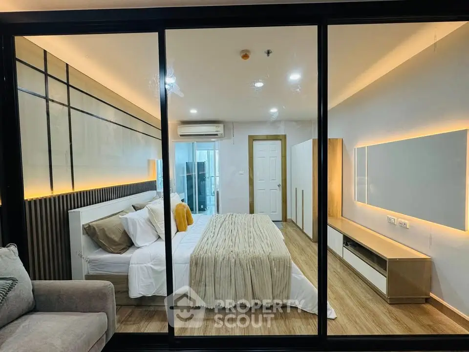 Modern bedroom with glass partition and stylish decor