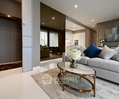 Luxurious modern living room with elegant decor and open kitchen layout.