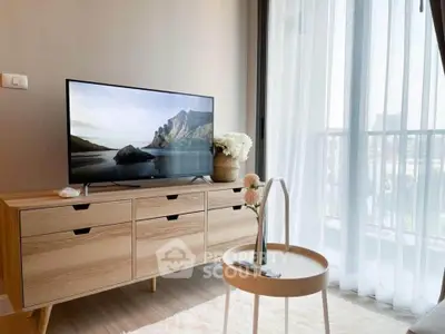 Modern living room with stylish TV stand and balcony view