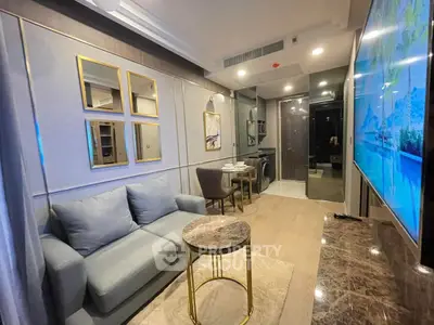 Modern living room with stylish furniture and open kitchen layout