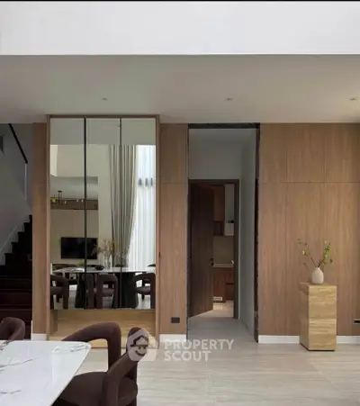 Modern open-plan living area with elegant dining space and stylish decor