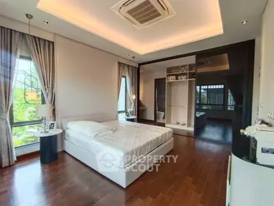 Luxurious bedroom with modern design and ample natural light