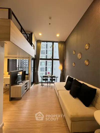 Modern living room with high ceiling and stylish decor in a luxury apartment