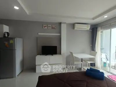 Modern studio apartment with sleek furniture and natural light