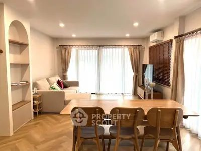 Spacious living room with modern decor and natural light