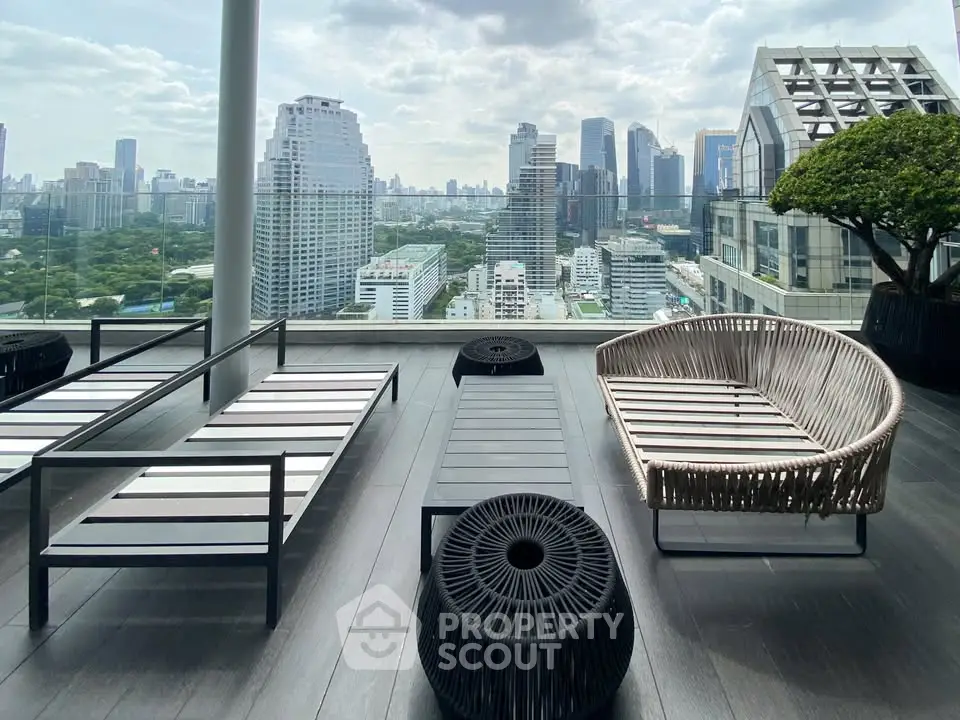 Luxurious rooftop terrace with stunning city skyline view and modern outdoor furniture.