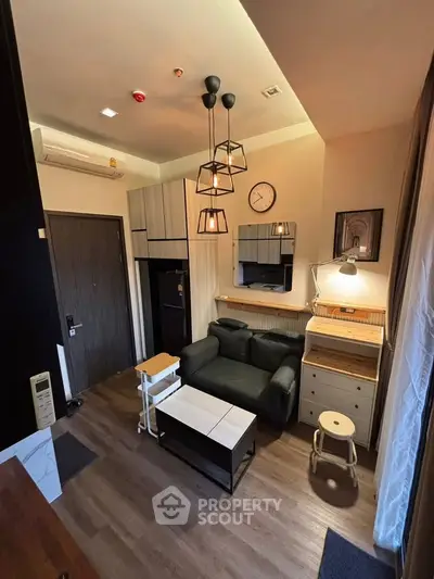 Modern living room with stylish furniture and ambient lighting in a cozy apartment.