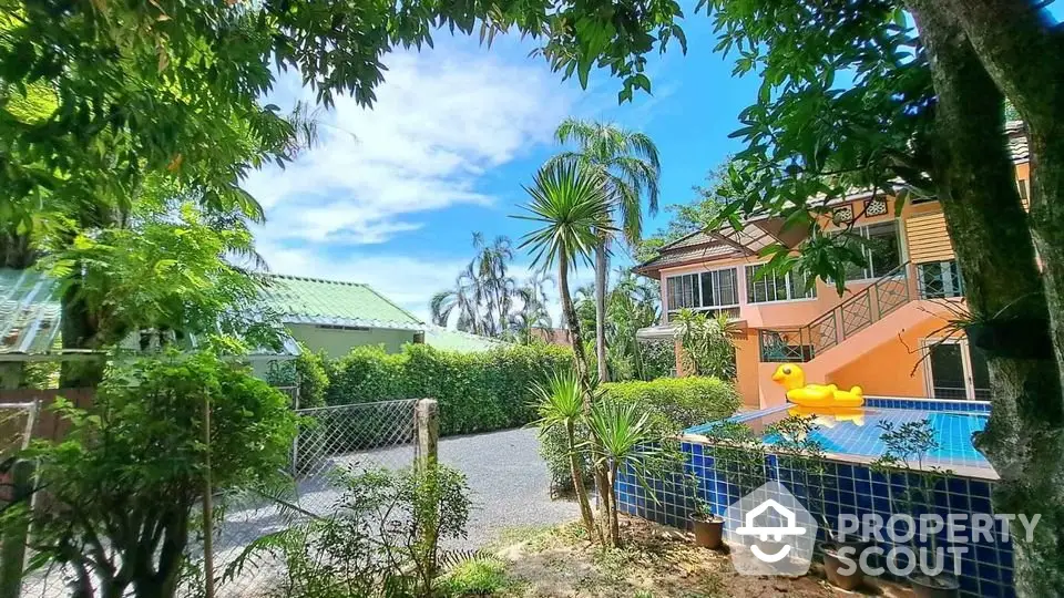 Charming tropical home with pool and lush garden, perfect for relaxation and outdoor enjoyment.