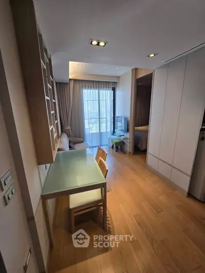 Modern apartment interior with wooden flooring and stylish furniture