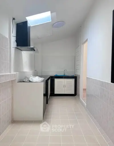 Modern kitchen with sleek design and ample natural light