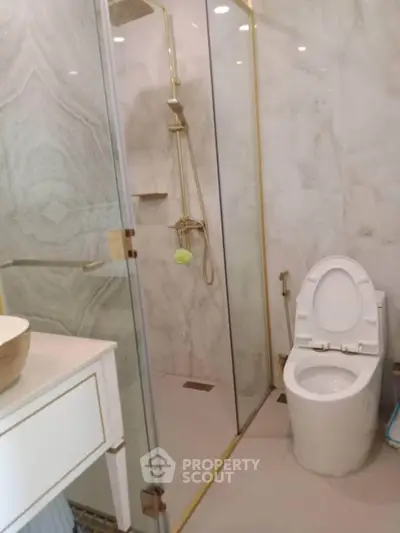 Luxurious bathroom with elegant marble walls and modern fixtures